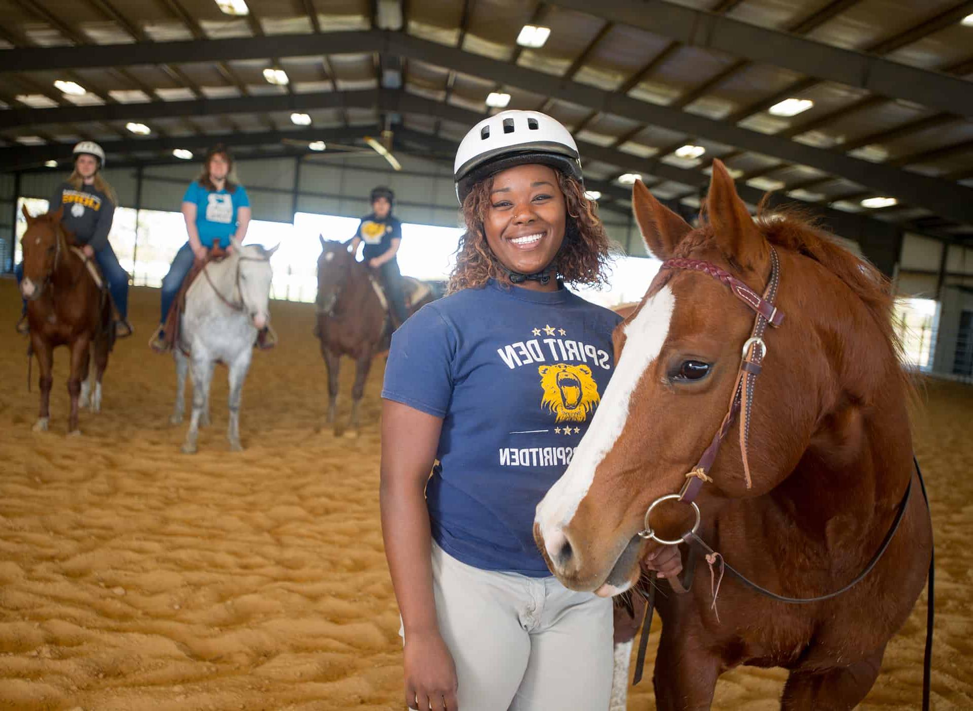 equine students with their horses.